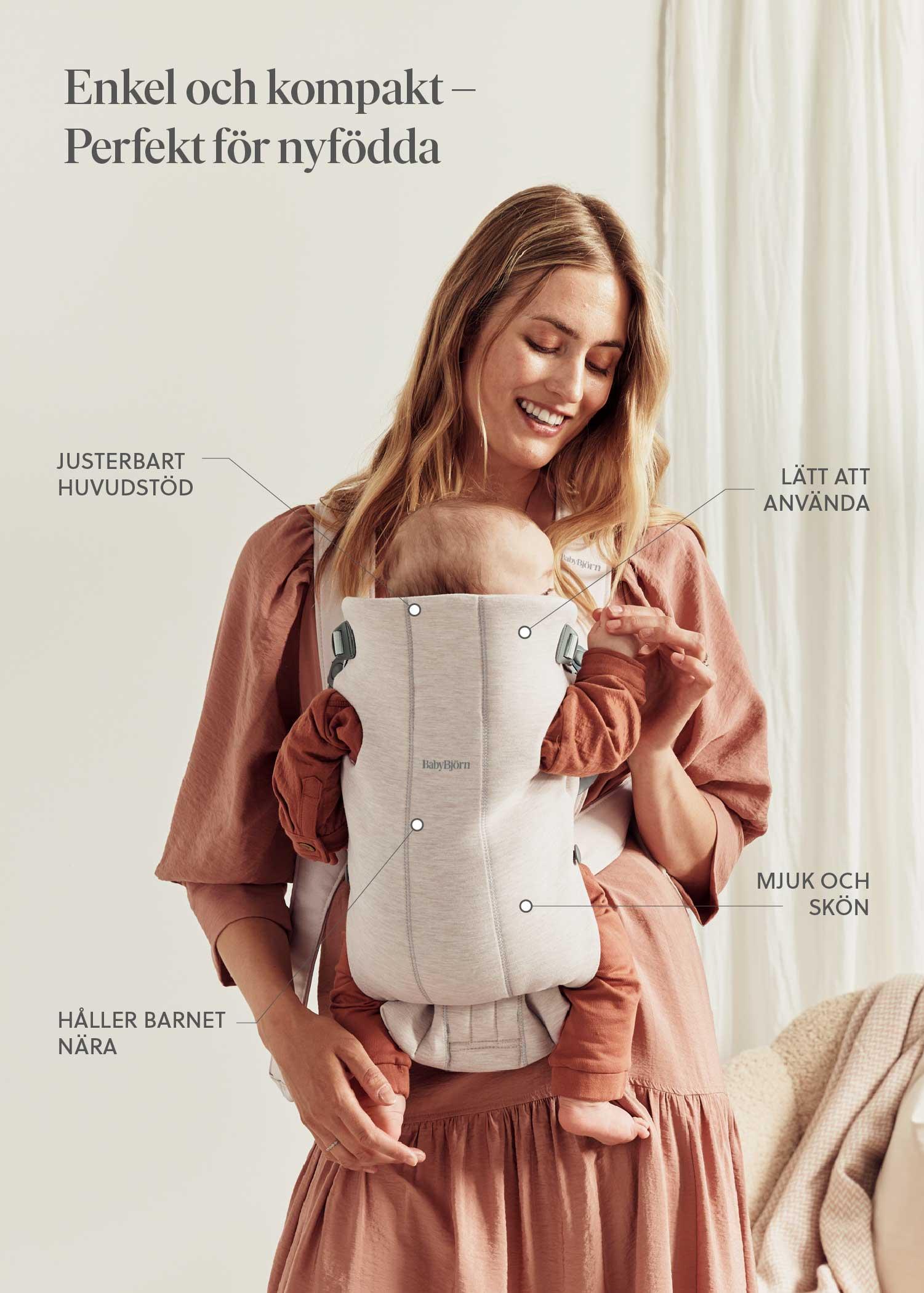 Woman smiling and holding a baby in a light gray carrier with adjustable head support. Swedish text highlights features like softness and ease of use.
